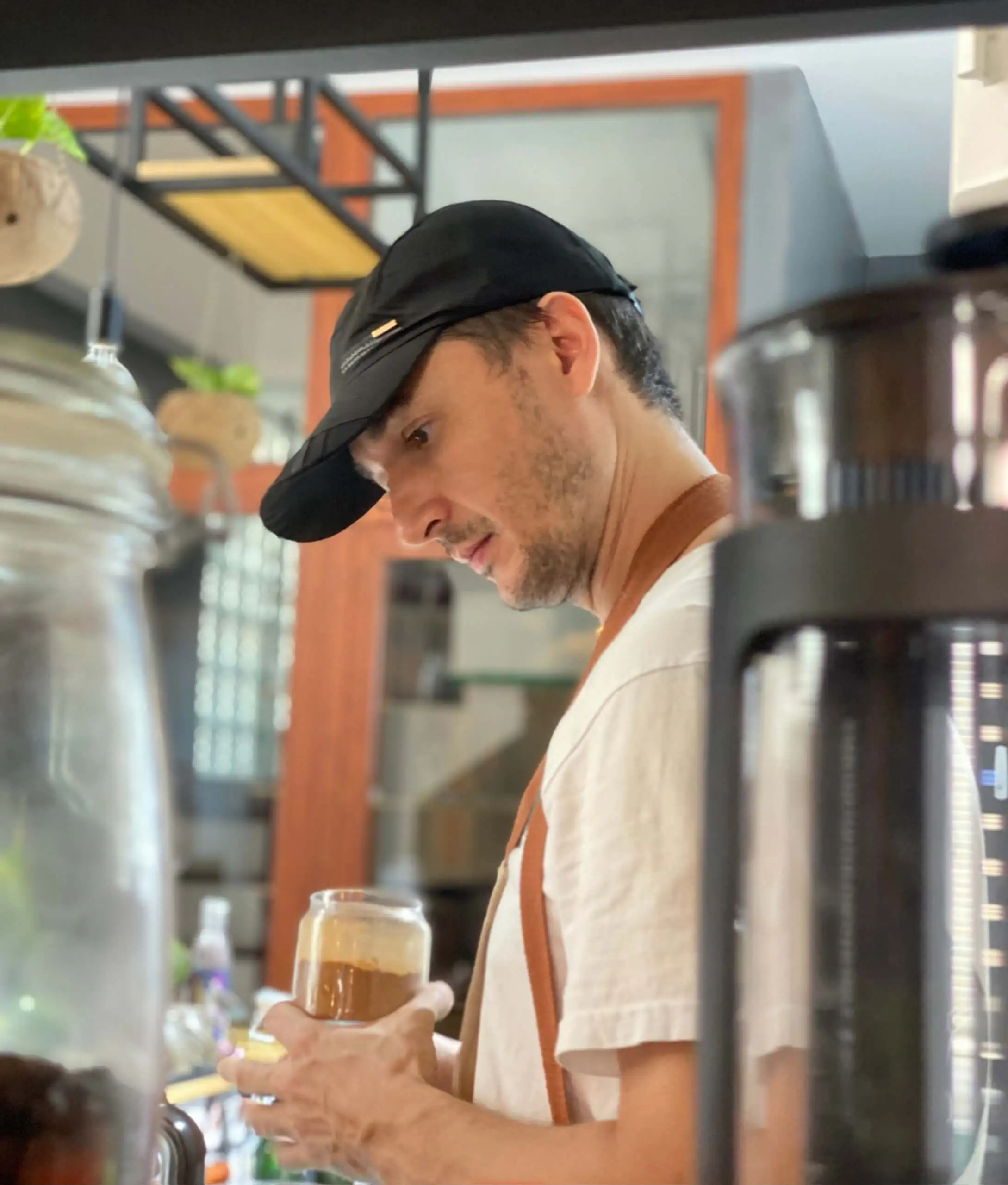 Vuko, co-founder of Green Monkey Saigon, preparing high-protein brunch dishes in Thao Dien